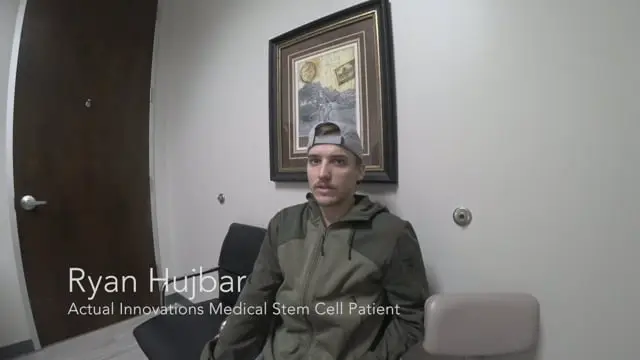 A young man in a green jacket and backwards cap sits in a medical office waiting room. A framed picture hangs behind him. Text on the image reads, Ryan Hujbar, Actual Innovations Medical Stem Cell Patient receiving stem cell therapy Dallas.